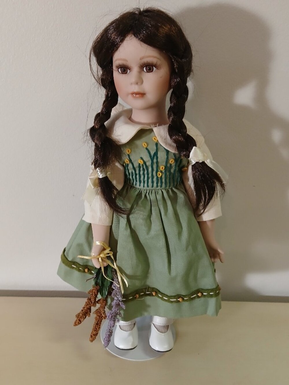 Pretty brunette small porcelain doll with stand - 14 inches tall